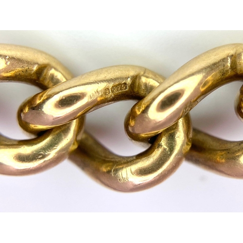 31 - A Vintage 9K Yellow Gold Chunky Curb Link Bracelet with a Heart Clasp. 58g total weight. 17cm.