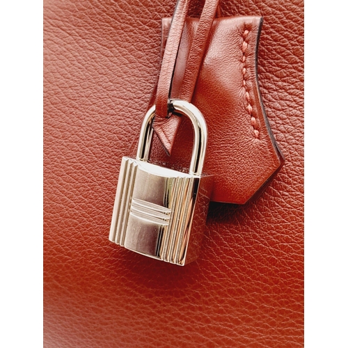 340 - A fabulous Hermes Red Birkin.
Quality leather throughout, double handled with silver toned hardware.... 