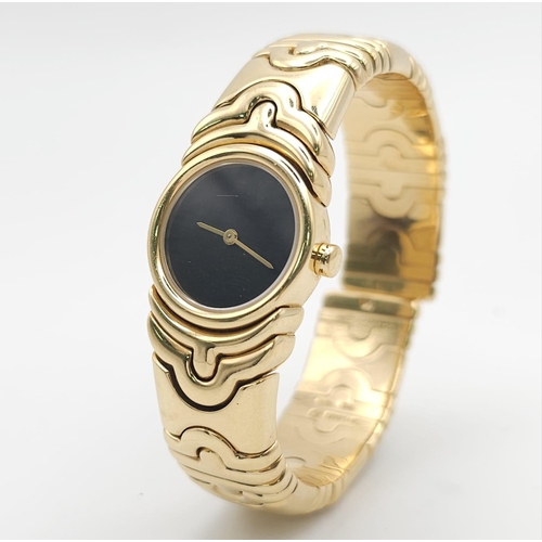 68 - A Bulgari Parentesi 18K Gold Ladies Watch. 18k gold decorative torque bracelet. 18k gold circular ca... 