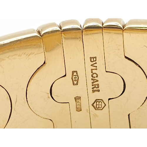 68 - A Bulgari Parentesi 18K Gold Ladies Watch. 18k gold decorative torque bracelet. 18k gold circular ca... 