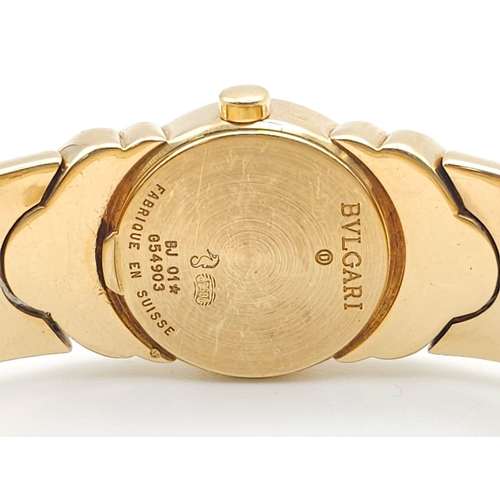 68 - A Bulgari Parentesi 18K Gold Ladies Watch. 18k gold decorative torque bracelet. 18k gold circular ca... 