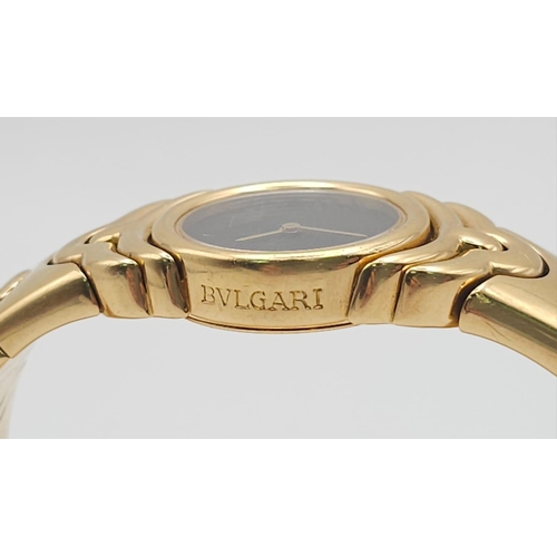 68 - A Bulgari Parentesi 18K Gold Ladies Watch. 18k gold decorative torque bracelet. 18k gold circular ca... 