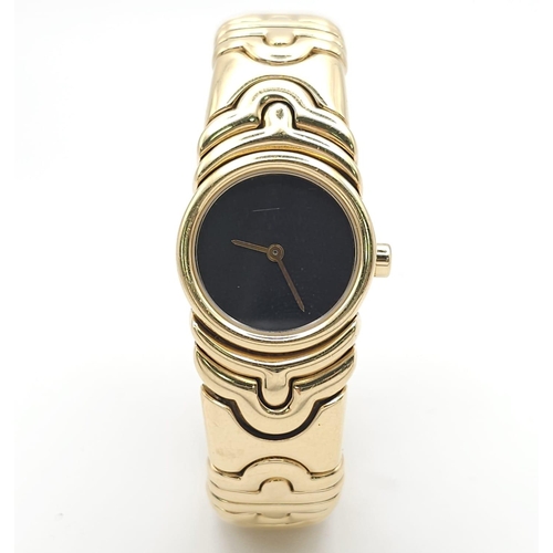 68 - A Bulgari Parentesi 18K Gold Ladies Watch. 18k gold decorative torque bracelet. 18k gold circular ca... 