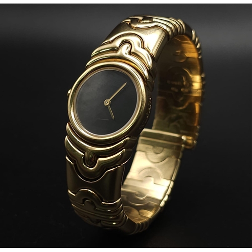 68 - A Bulgari Parentesi 18K Gold Ladies Watch. 18k gold decorative torque bracelet. 18k gold circular ca... 