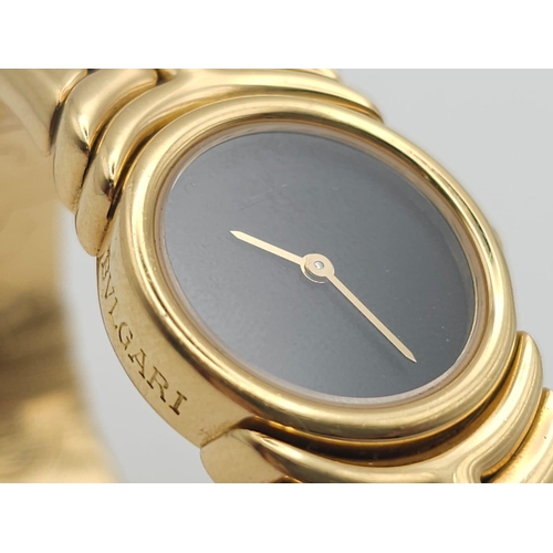 68 - A Bulgari Parentesi 18K Gold Ladies Watch. 18k gold decorative torque bracelet. 18k gold circular ca... 