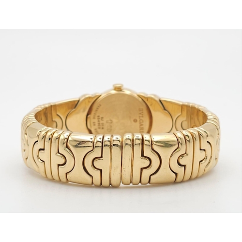 68 - A Bulgari Parentesi 18K Gold Ladies Watch. 18k gold decorative torque bracelet. 18k gold circular ca... 