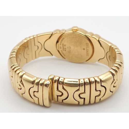 68 - A Bulgari Parentesi 18K Gold Ladies Watch. 18k gold decorative torque bracelet. 18k gold circular ca... 