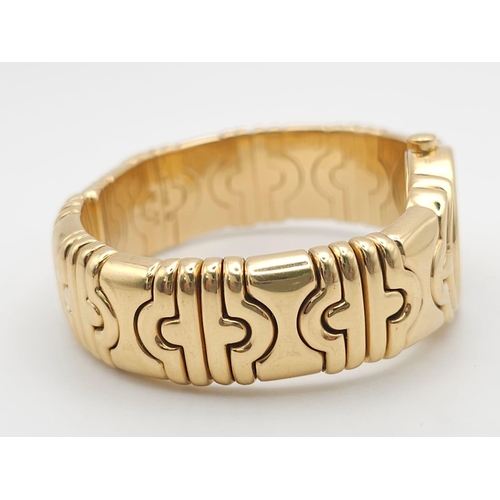 68 - A Bulgari Parentesi 18K Gold Ladies Watch. 18k gold decorative torque bracelet. 18k gold circular ca... 