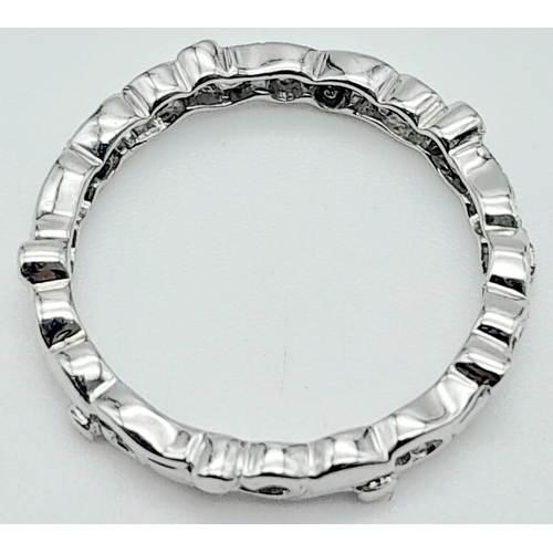 877 - A 9KT White Gold, Diamond Set Ring.
With unique, scrolling design.
Size: L
Weight: 1.92g