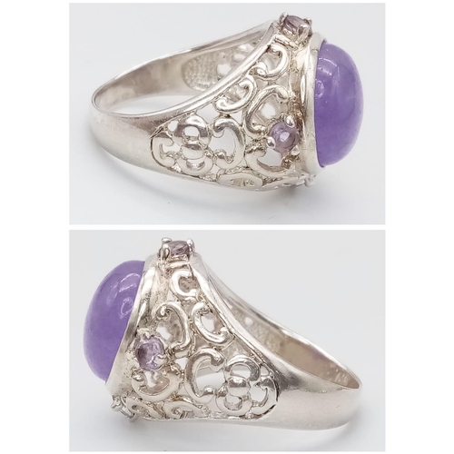 1264 - A Vintage Sterling Silver, Filigree Design, 1.3cm Round, Amethyst Cabochon
Ring Size P. Set with a c... 