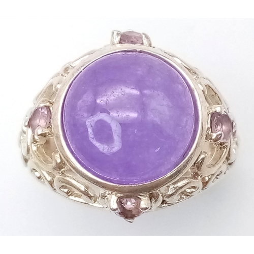 1264 - A Vintage Sterling Silver, Filigree Design, 1.3cm Round, Amethyst Cabochon
Ring Size P. Set with a c... 