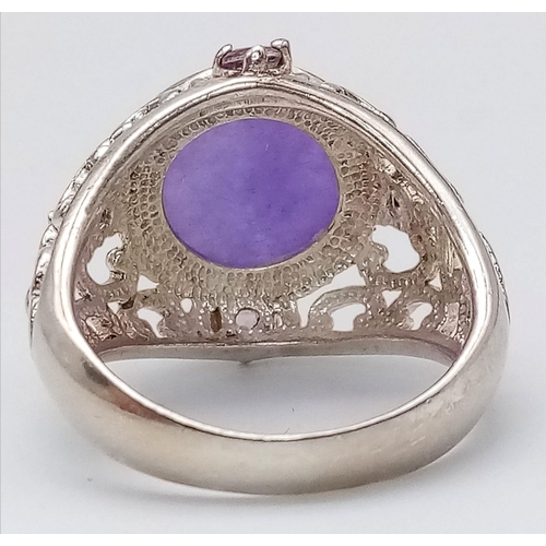 1264 - A Vintage Sterling Silver, Filigree Design, 1.3cm Round, Amethyst Cabochon
Ring Size P. Set with a c... 