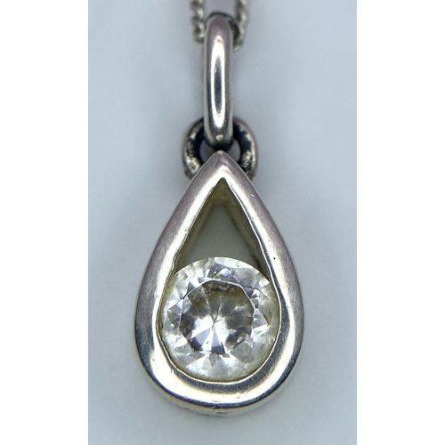 1454 - 2X 925 silver Cubic Zirconia pendants on silver chains. Total weight 9.72G. Both have length of 46cm