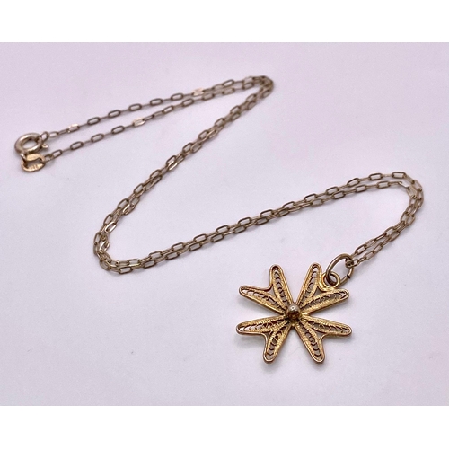 1475 - A 925 gilded silver Filigree Maltese cross pendant on silver chain. Total weight 2G. Total length 40... 