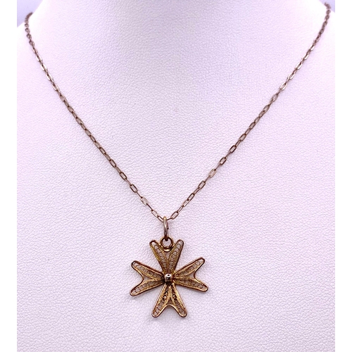 1475 - A 925 gilded silver Filigree Maltese cross pendant on silver chain. Total weight 2G. Total length 40... 