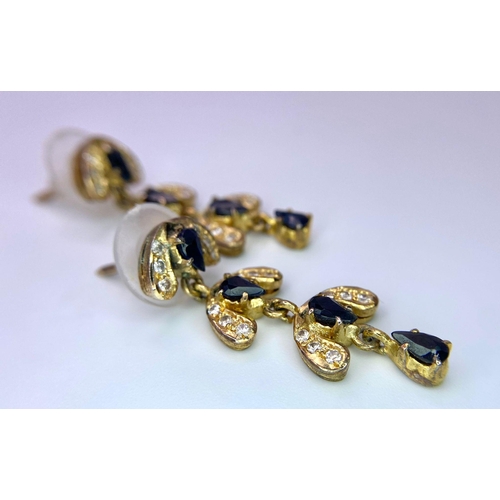 563 - A Pair of 9K Yellow Gold, Diamond and Sapphire Drop Earrings. 3.12g total weight. 3.5cm drop. Ref: 1... 