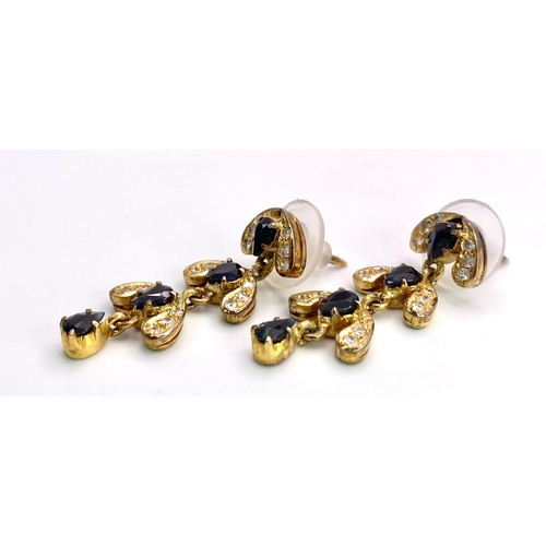 563 - A Pair of 9K Yellow Gold, Diamond and Sapphire Drop Earrings. 3.12g total weight. 3.5cm drop. Ref: 1... 