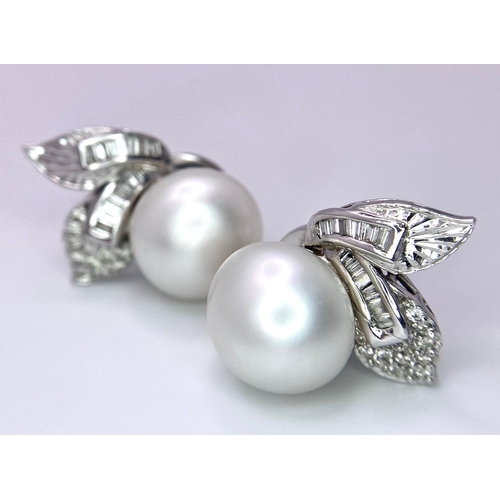 577 - A Pair of 14K White Gold, Diamond and South Sea Pearl Earrings. Large, rich, bulbous South Sea Pearl... 