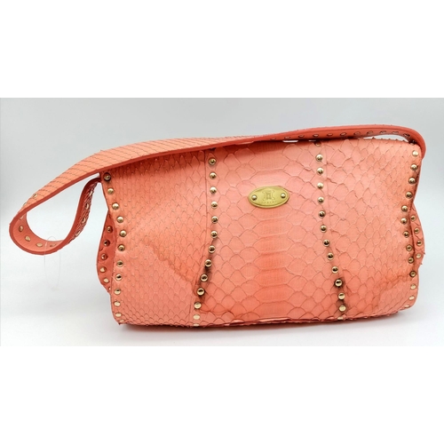 692 - The Celine bag in a delightful shade of pink is a stylish accessory crafted in Italy. With dimension... 