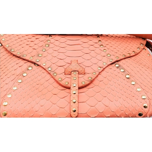 692 - The Celine bag in a delightful shade of pink is a stylish accessory crafted in Italy. With dimension... 