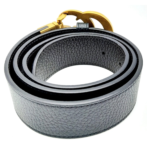 938 - Stylish Gucci Black Leather Belt.
Famed GG logo buckle, this belt features gold tone hardware throug... 