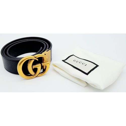 938 - Stylish Gucci Black Leather Belt.
Famed GG logo buckle, this belt features gold tone hardware throug... 