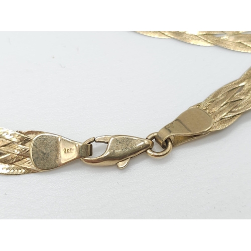 412 - A 9K GOLD INTERWOVEN NECKLACE .  6.4gms   40cms