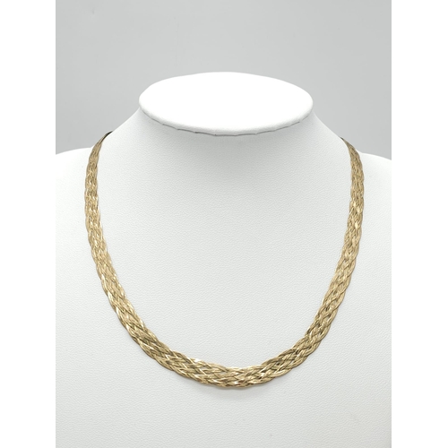 412 - A 9K GOLD INTERWOVEN NECKLACE .  6.4gms   40cms