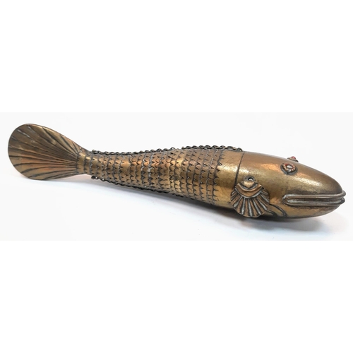 484 - An antique 19th century, large Brass Medina articulated fish. 
In excellent condition but has one gl... 