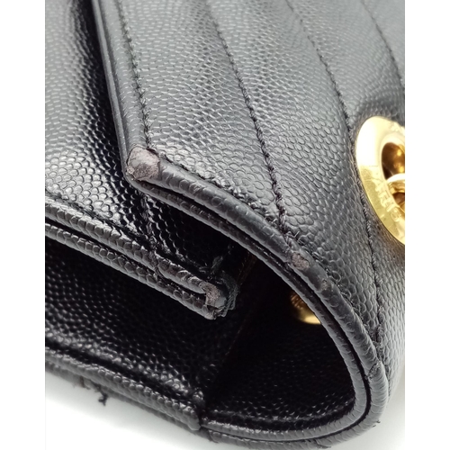 584 - The Saint Laurent YSL Large Envelope Chain Flap Bag is a sophisticated choice in black Grain de Poud... 