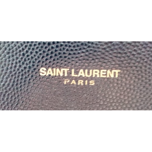 584 - The Saint Laurent YSL Large Envelope Chain Flap Bag is a sophisticated choice in black Grain de Poud... 