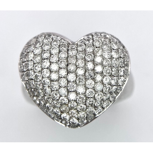 690 - A Designer 18K White Gold (DNA Marking) Diamond Heart Pave Ring. A large central diamond encrusted h... 