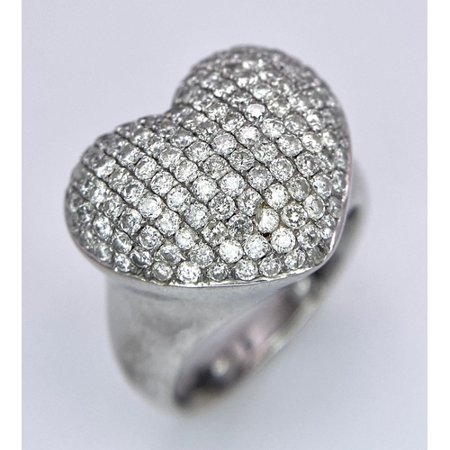 690 - A Designer 18K White Gold (DNA Marking) Diamond Heart Pave Ring. A large central diamond encrusted h... 