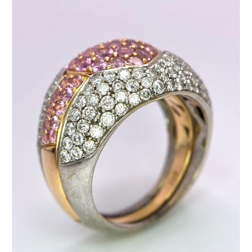 697 - An Ultra-Glamourous 18K White and Yellow Gold Diamond and Pink Stone Heart Ring. A central pink ston... 