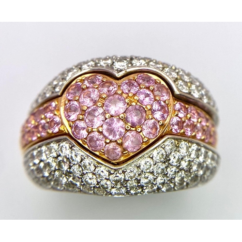 697 - An Ultra-Glamourous 18K White and Yellow Gold Diamond and Pink Stone Heart Ring. A central pink ston... 