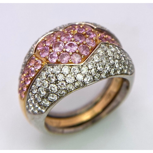 697 - An Ultra-Glamourous 18K White and Yellow Gold Diamond and Pink Stone Heart Ring. A central pink ston... 