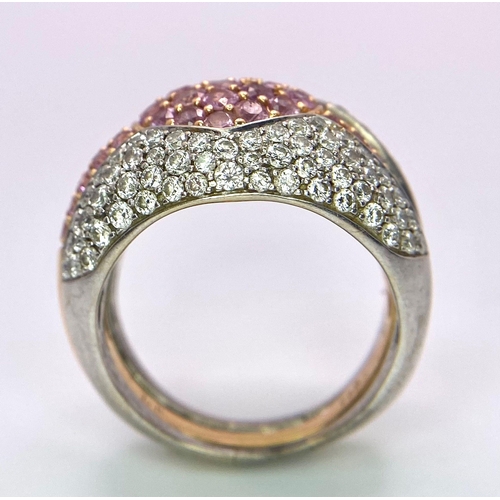 697 - An Ultra-Glamourous 18K White and Yellow Gold Diamond and Pink Stone Heart Ring. A central pink ston... 