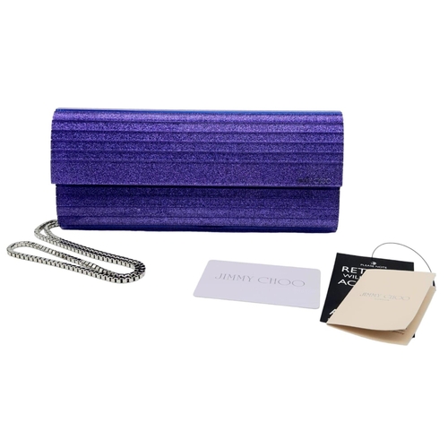 699 - The Jimmy Choo Sweetie Clutch in a luxurious shade of purple is a stylish accessory measuring 25cm i... 