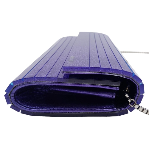 699 - The Jimmy Choo Sweetie Clutch in a luxurious shade of purple is a stylish accessory measuring 25cm i... 