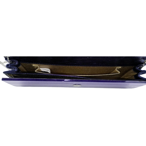 699 - The Jimmy Choo Sweetie Clutch in a luxurious shade of purple is a stylish accessory measuring 25cm i... 