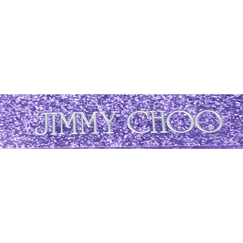 699 - The Jimmy Choo Sweetie Clutch in a luxurious shade of purple is a stylish accessory measuring 25cm i... 