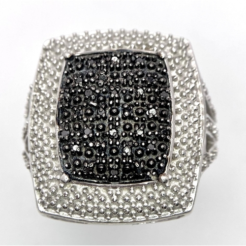 1292 - An Unworn Limited Edition (1 of 199 Pieces worldwide) Black Diamond
Statement Ring Size T. Set with ... 