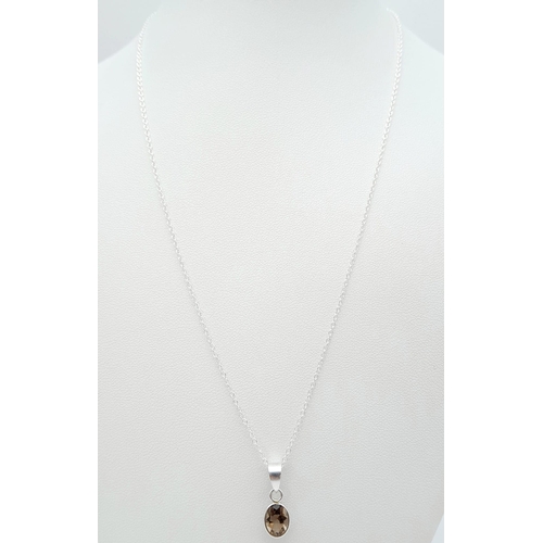 1433 - A 925 silver smoky Quartz pendant on silver chain. Total weight 2G. Total length 46cm. 925 hallmarke... 