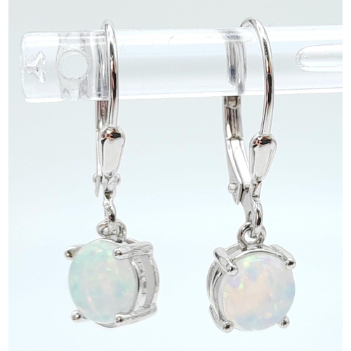 1468 - Collection of Sterling Silver, Opal Jewellery.
Opal pendant Necklace, 46cm in length and a pair of h... 