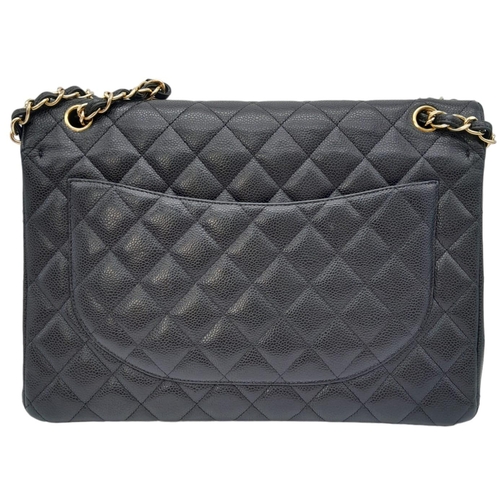 570 - Chanel The Large Classic Handbag exudes timeless elegance with its grained calfskin and gold-tone me... 