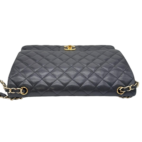 570 - Chanel The Large Classic Handbag exudes timeless elegance with its grained calfskin and gold-tone me... 