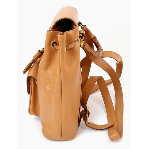 604 - The Gucci Bamboo Leather Backpack in rich brown leather combines style and functionality seamlessly.... 