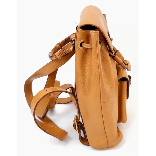 604 - The Gucci Bamboo Leather Backpack in rich brown leather combines style and functionality seamlessly.... 