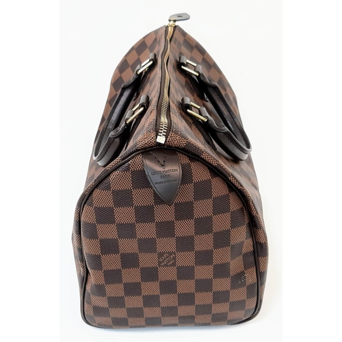 645 - The Louis Vuitton Speedy 35 in Damier Ebene canvas is a timeless and elegant handbag, measuring 31cm... 