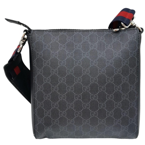 666 - A Black Gucci Cross-Over Satchel.
With a quality red & navy adjustable strap, this satchel can be wo... 